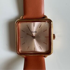 Square face watch with brick red leather straps
